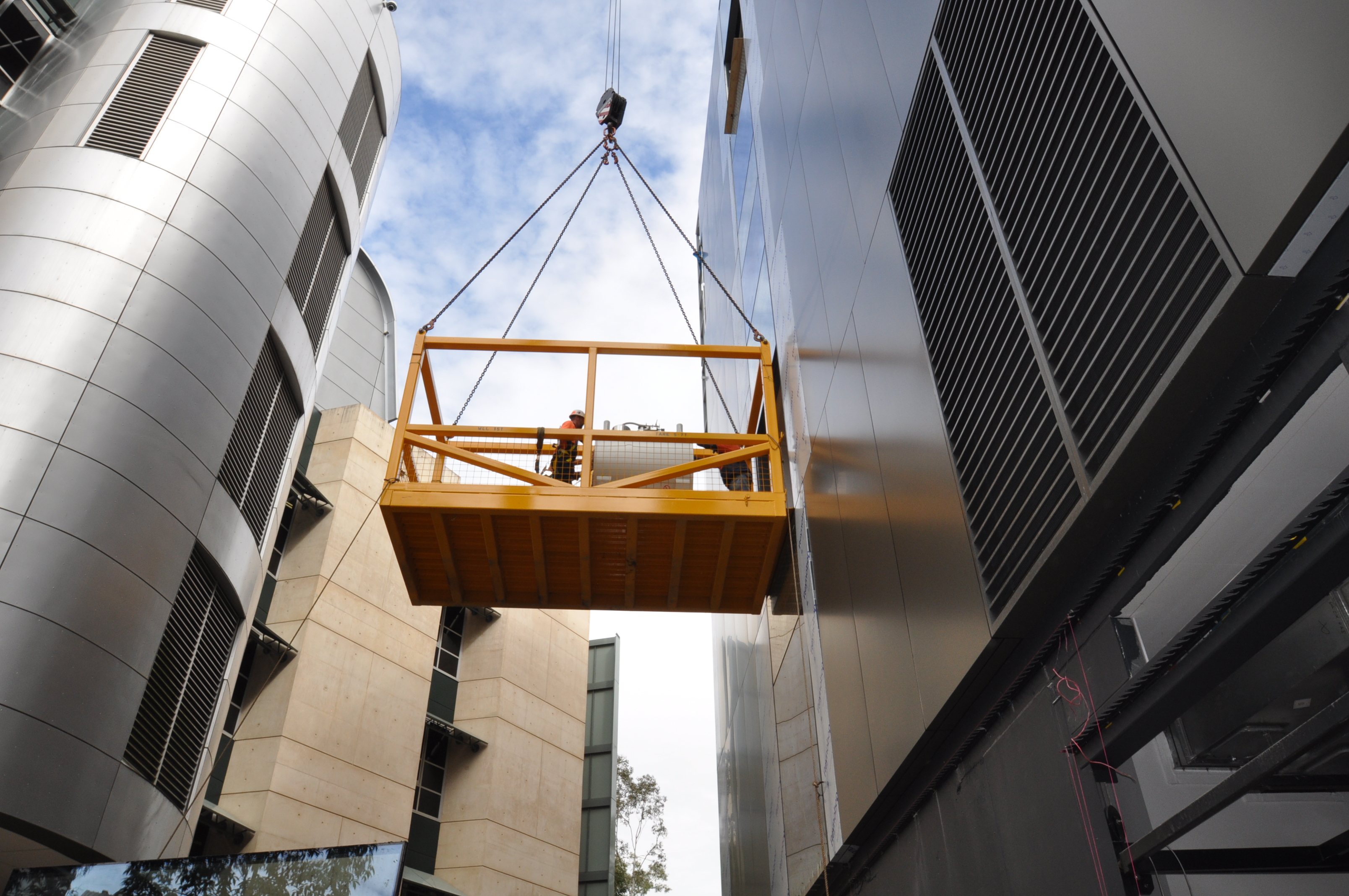 MRI machine being craned into building