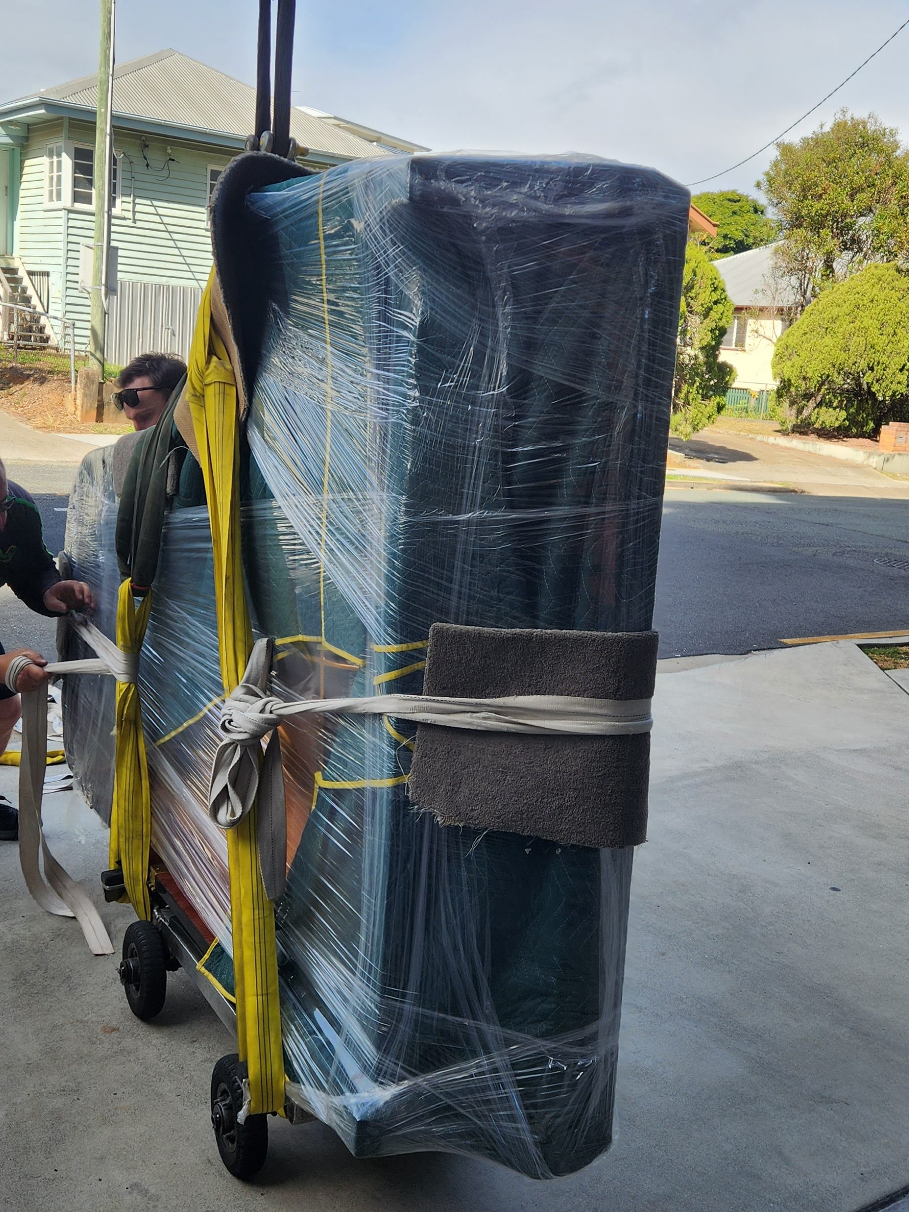 New scientific air tables in packaging being transported into building