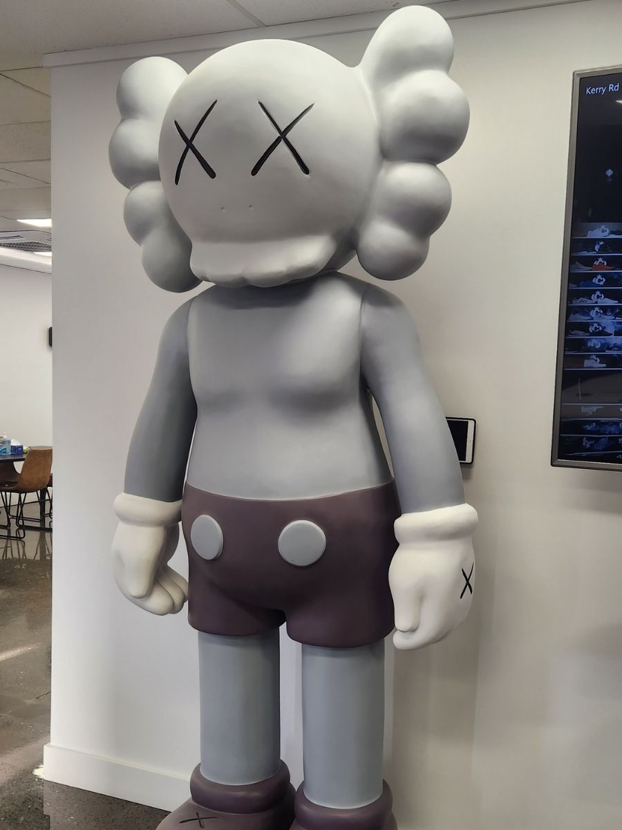 Grey large abstract sculpture relocated to office building
